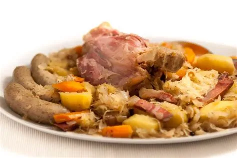 Can you resist the allure of Choucroute garnie? A hearty symphony of fermented cabbage, smoky meats, and savory delights!