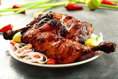  Tandoori Chicken: Savory Smoke Meets Tangy Tenderness in Indore's Culinary Paradise!